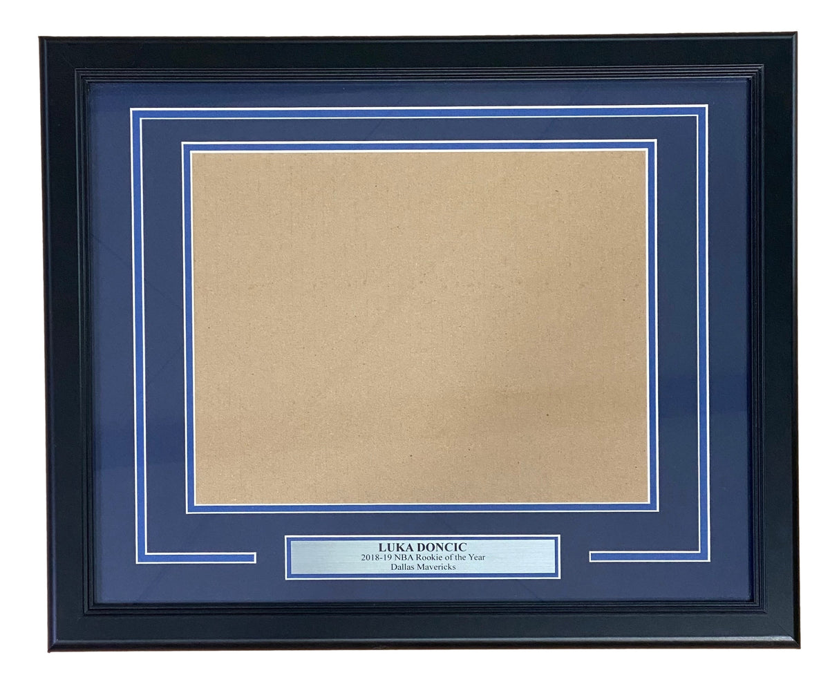 The Sports Integrity Luka Doncic Dallas Mavericks 11x14 Horizontal Photo Frame Kit features a black frame, blue mat, empty photo slot, and a silver plaque that reads "Luka Doncic 2018-19 NBA Rookie of the Year Dallas Mavericks.