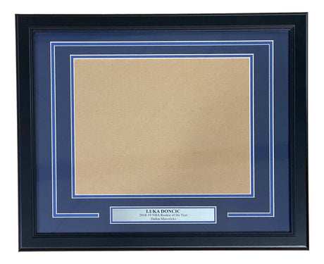 The Sports Integrity Luka Doncic Dallas Mavericks 11x14 Horizontal Photo Frame Kit features a black frame, blue mat, empty photo slot, and a silver plaque that reads "Luka Doncic 2018-19 NBA Rookie of the Year Dallas Mavericks.