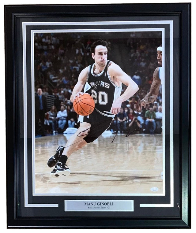 Sports Integrity Manu Ginobili Signed Framed 16x20 Spurs Photo features #20 dribbling on court, includes autograph and nameplate; JSA authenticated.