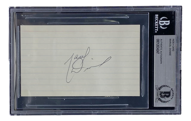 A signed index card by Marcel Dionne (Quebec Nordiques) is displayed in a transparent Sports Integrity BAS slab, labeled: Index Card, Marcel Dionne, Authentic Autograph.
