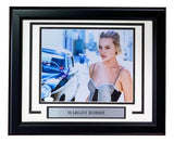 Margot Robbie Signed Framed 8x10 Photo by Sports Integrity features her in a black and white dress by a vintage car, complete with autograph and nameplate.