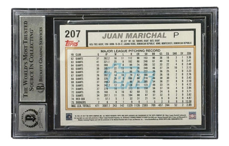 A Sports Integrity Juan Marichal signed 2017 Topps #207 San Francisco Giants card, graded BAS Auto 10, featuring black borders and detailed career pitching stats on the back.