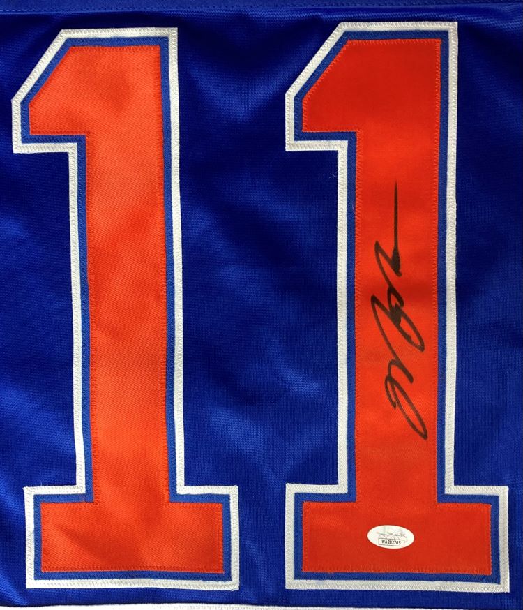 The Mark Messier Edmonton Signed Blue Hockey Jersey by Sports Integrity features large orange and white number 11, a black signature on the right digit, and an authentication sticker at the bottom.