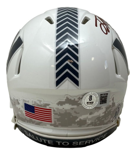 The Sports Integrity Terry McLaurin Signed Commanders Salute to Service Mini Speed Helmet BAS w/ Case features a white back view with chevron stripe, American flag sticker, camouflage pattern, and "SALUTE TO SERVICE" on the black bottom bumper.