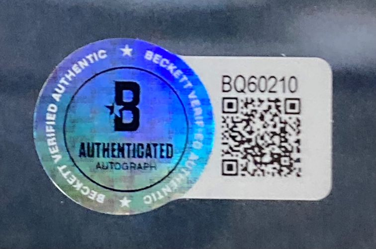 A Christopher Mintz-Plasse Signed Framed 8x10 Superbad McLovin Photo by Sports Integrity features a Beckett authentication sticker with holographic "B", "Authenticated Autograph", a QR code, and code BQ60210 on a white background.
