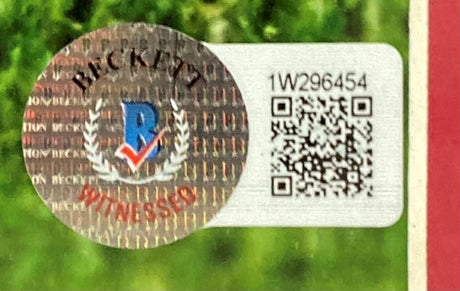 A Beckett Witnessed sticker with a holographic seal, serial number 1W296454, and QR code is affixed to the Sports Integrity Mia Hamm Signed Framed 16x20 USA Women's Soccer Collage Photo (BAS ITP) with a green background.