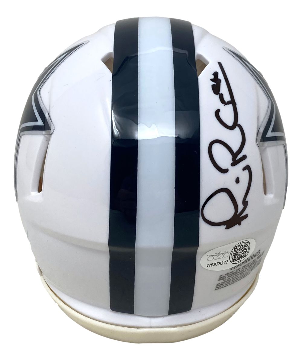 The Michael Irvin Signed Dallas Cowboys White Mini Speed Helmet by Sports Integrity features a dark blue center stripe, black signature on top, and partially visible team star logos. Includes JSA QR hologram for authenticity.