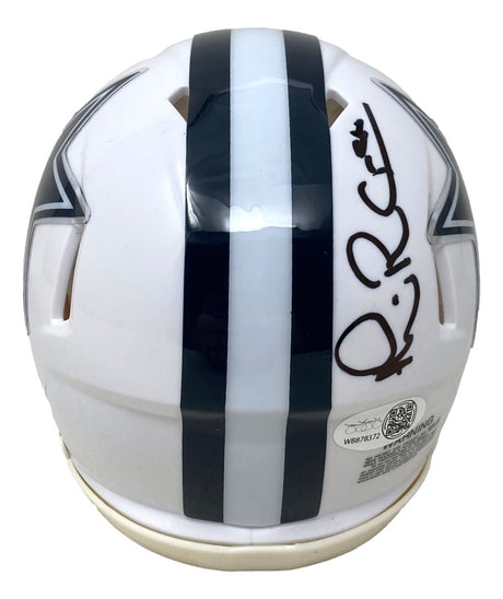 The Michael Irvin Signed Dallas Cowboys White Mini Speed Helmet by Sports Integrity features a dark blue center stripe, black signature on top, and partially visible team star logos. Includes JSA QR hologram for authenticity.