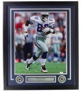 Sports Integrity Michael Irvin Signed Framed 16x20 Dallas Cowboys Photo JSA features Irvin running on the field, autographed in blue marker. The frame includes a plaque and two star emblems at the bottom.