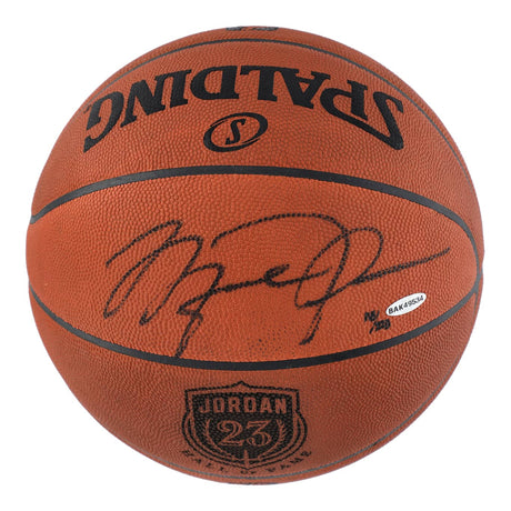 A Sports Integrity Michael Jordan Bulls Signed NBA Spalding Hall Of Fame Logo Basketball LE/223 UDA, featuring his visible signature in black ink, a JORDAN 23 logo, and an authentication sticker.