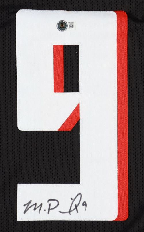 A Michael Penix Jr Atlanta Signed Black Football Jersey by Sports Integrity features a stitched white number 9 with a red outline, his signature at the bottom, and an authentication sticker near the top.