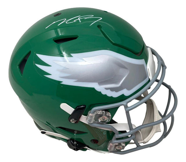 The Sports Integrity Michael Vick Signed Philadelphia Eagles FS Kelly Green SpeedFlex Helmet BAS features a silver eagle wing logo, gray facemask, and white autograph on a green shell.