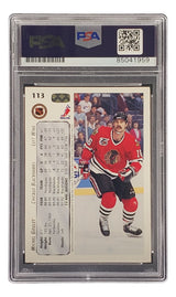 The Michel Goulet Signed 1992 Upper Deck #113 Chicago Blackhawks Hockey Card by Sports Integrity features him in a red uniform and helmet on ice, encased in PSA/DNA for authenticity.