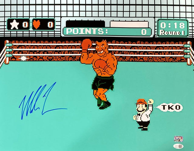 Photo of a boxer in green shorts with raised fist from Punch-Out!!, autographed in blue by Mike Tyson. Sports Integrity 16x20 print comes with JSA QR hologram authentication.