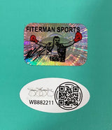 A holographic Sports Integrity sticker showing a boxer with red gloves is above an oval with a signature, QR code, and code WB882211 on teal, authenticating the Mike Tyson Signed 16x20 Boxing Punch Out Photo JSA QR Hologram.