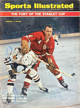 The Sports Integrity Stan Mikita Bill Gadsby Signed Sports Illustrated Magazine Cover PSA features both hockey legends in action during a heated Detroit Red Wings vs. Chicago Blackhawks Stanley Cup game.