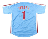 The Sports Integrity Miles Teller Philadelphia Signed Light Blue Baseball Jersey (BAS BT57636) features red and white trim, TELLER and number 1 on the back in white with a red outline, plus an autograph below the number.