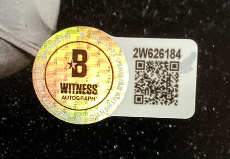 A Beckett Witness sticker and a white label with code “2W626184” and a QR code are attached to the Milton Williams Signed 8x10 Eagles Super Bowl 59 Mahomes Strip Sack Photo from Sports Integrity.