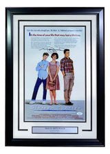 Sports Integrity's Molly Ringwald Signed Framed 11x17 Sixteen Candles Movie Poster Photo features the three main characters, their signatures, a plaque with Molly Ringwald's name, and comes in a black frame with a light background. Authenticated by JSA ITP.