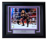 The Sports Integrity Nia Jax Signed Framed 8x10 WWE Photo from Fanatics features her autograph, an action ring pose, cheering fans in the background, and a name/title plaque reading "The Irresistible Force.