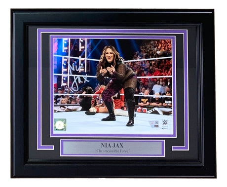 The Sports Integrity Nia Jax Signed Framed 8x10 WWE Photo from Fanatics features her autograph, an action ring pose, cheering fans in the background, and a name/title plaque reading "The Irresistible Force.