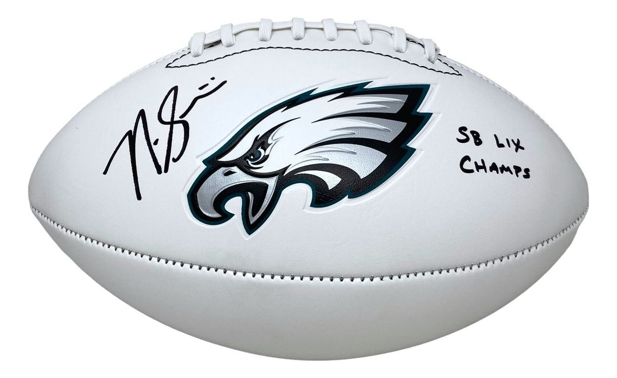 A Sports Integrity football featuring the Eagles logo, signed by Nick Sirianni with “SB LIX Champs” inscription.