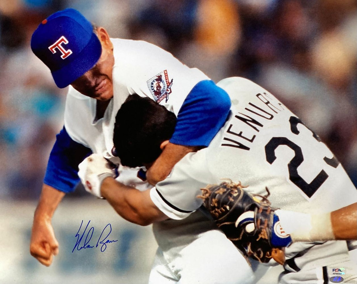 The Nolan Ryan Signed 16x20 Texas Rangers Ventura Fight Photo by Sports Integrity captures the iconic moment when Ryan puts Ventura in a headlock during their intense on-field altercation. PSA/DNA authenticated.