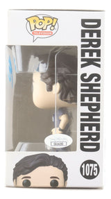A Patrick Dempsey signed Grey's Anatomy Funko Pop #1075 by Sports Integrity is displayed in its box, featuring a clear window and bold character name on the front.