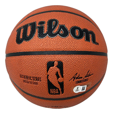 The Sports Integrity Patrick Ewing New York Knicks Signed NBA Wilson I/O Basketball features a textured orange surface, black lines, the NBA logo, product details, and Patrick Ewing's signature.