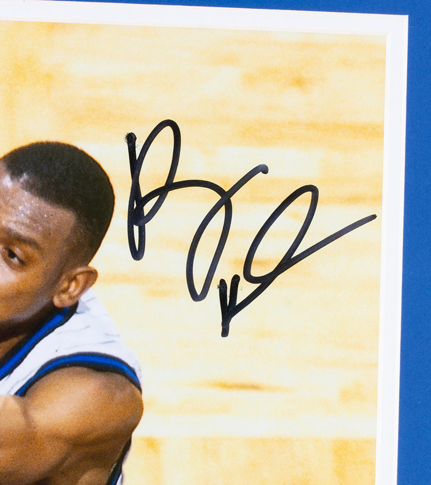 A close-up of a framed Sports Integrity Penny Hardaway Signed Orlando Magic 16x20 Dunk Photo shows his autograph across the upper right, authenticated by a PSA hologram.