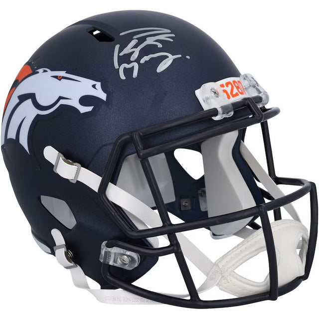 The Sports Integrity Peyton Manning Signed Denver Broncos Full Size Speed Replica Helmet by Fanatics features the team logo, a white facemask, and Peyton Manning’s silver signature on top.
