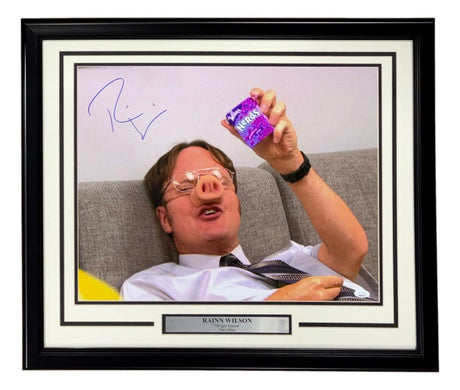 The Sports Integrity Rainn Wilson Signed Framed 16x20 "The Office" Dwight Schrute Nerds Photo features Rainn, glasses and fake pig nose on, holding pudding and smiling. Autographed in blue ink with a nameplate. JSA certified.