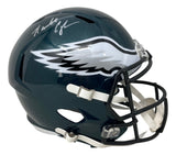 A Randall Cunningham-signed Philadelphia Eagles FS Speed Replica Helmet by Sports Integrity, featuring the team's wing logo and dark green design.