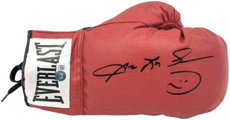 A Sugar Ray Leonard signed red Everlast right hand boxing glove by Sports Integrity, featuring a black autograph and smiley face on a white background.
