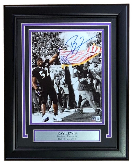 The Sports Integrity Ray Lewis Signed Framed 8x10 Baltimore Ravens Flag Photo (BAS ITP) features Ray Lewis celebrating on the field in uniform with an American flag, plus a plaque noting his Hall of Fame 2018 induction.