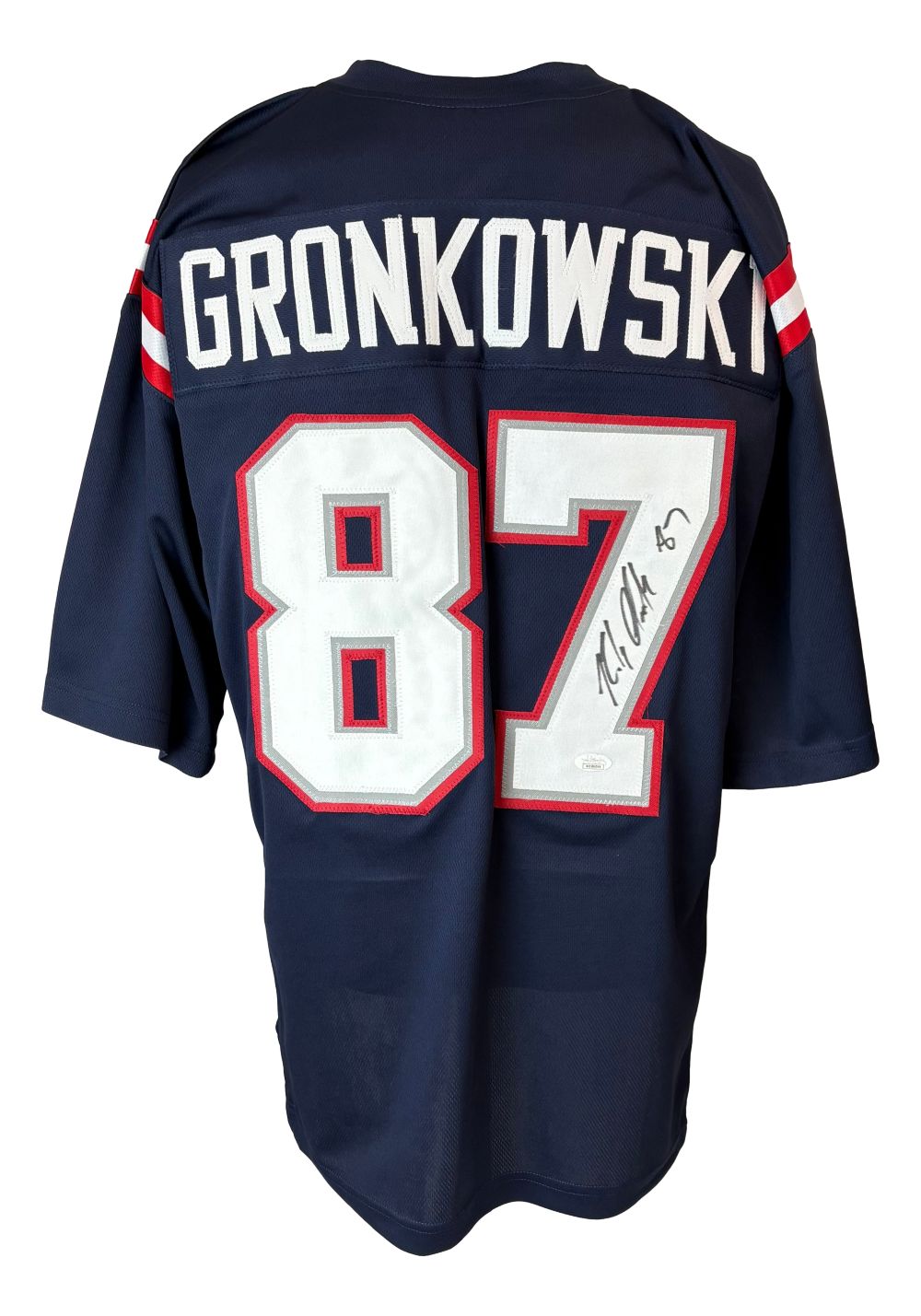 The Sports Integrity Rob Gronkowski New England Signed Alternate Blue Football Jersey (JSA Hologram) is a navy blue, short-sleeve jersey with red and white stripes, featuring “GRONKOWSKI” and #87 in white/red, autographed on the number.