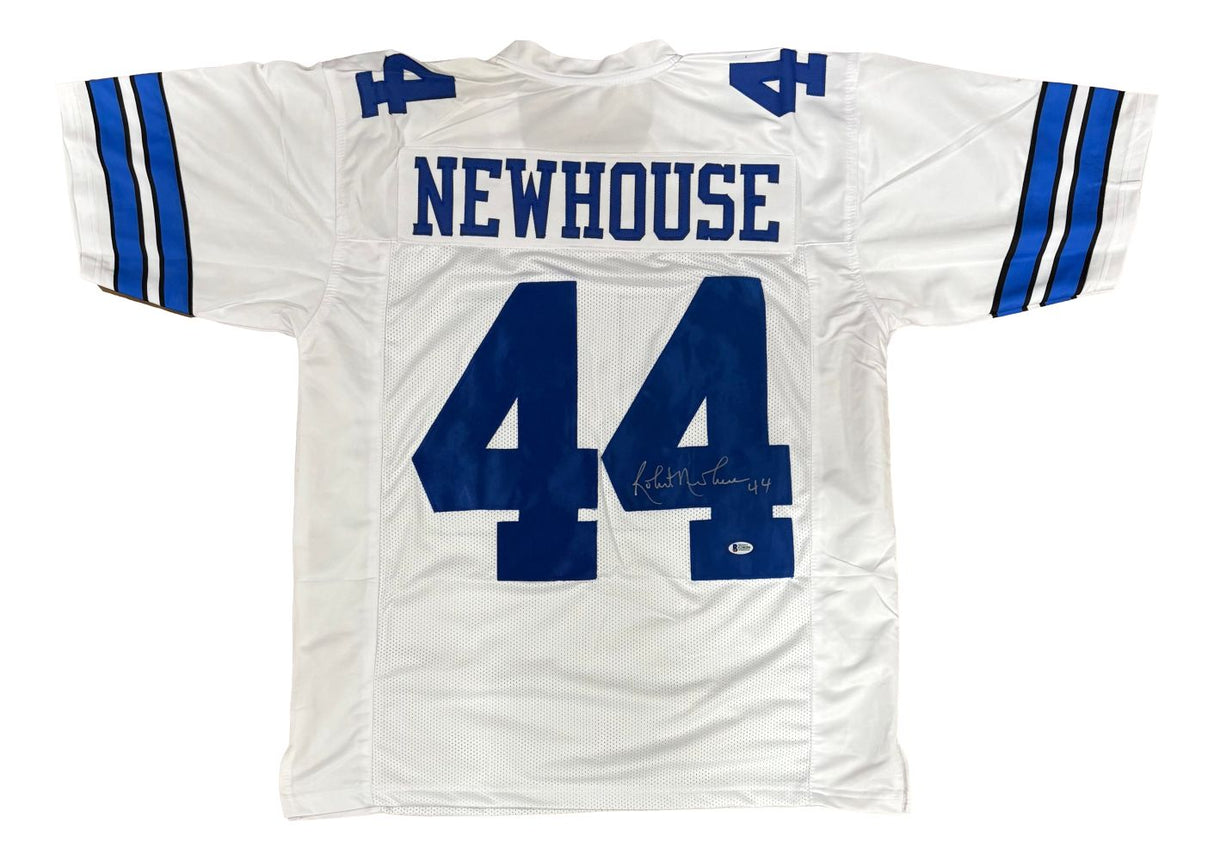 The Sports Integrity Robert Newhouse Dallas Signed White Football Jersey BAS is white with blue sleeve stripes, "NEWHOUSE" above number 44, and features his autograph on the lower part of the right number 4.