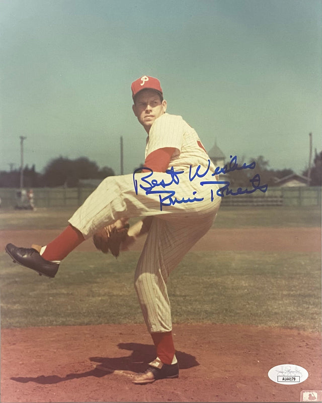 Sports Integrity offers a Robin Roberts Signed 8x10 Philadelphia Phillies Photo (JSA AL44179), featuring him in a vintage uniform winding up to pitch. The photo is autographed in blue ink with “Best Wishes” and his signature.
