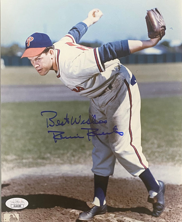 Sports Integrity Robin Roberts Signed 8x10 Philadelphia Phillies Photo (JSA AL44180) features a vintage image of Roberts mid-pitch, with "Best Wishes" and his signature in blue ink across the photo.