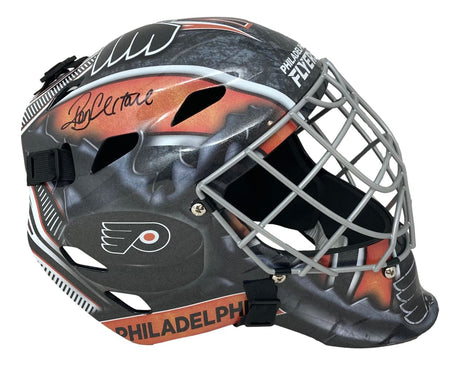 The Sports Integrity Ron Hextall Signed Philadelphia Flyers Full Size Replica Goalie Mask features the team logo and black marker signature, with a black, orange, and gray design.