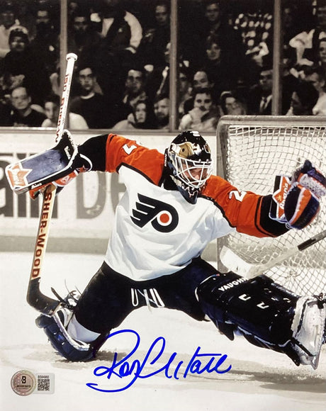 The Ron Hextall Signed 8x10 Philadelphia Flyers Glove Save Photo by Sports Integrity features Hextall making a dramatic save and is autographed in blue ink at the bottom.