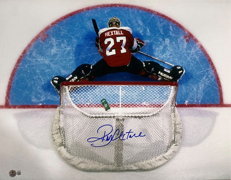 This Sports Integrity Ron Hextall Signed 16x20 Philadelphia Flyers Photo shows Hextall in a red jersey making a split save, signed in blue ink across the net and viewed from above. Authenticated by BAS.