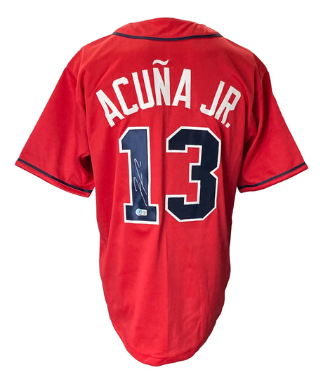 A Ronald Acuna Jr. Signed Custom Red Pro-Style Baseball Jersey by Sports Integrity, featuring “ACUÑA JR.” and number 13 in white and navy on the back with an autograph on the number 1.