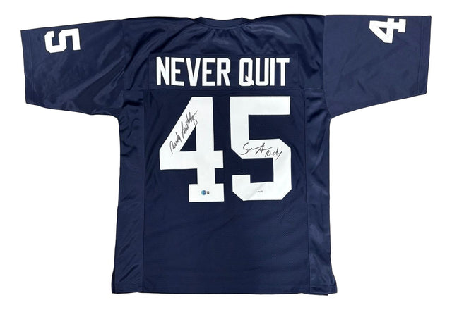 The Sports Integrity Rudy Ruettiger Sean Astin Notre Dame Blue Never Quit Jersey features white "NEVER QUIT" above #45, signatures on/near the number, and #45 on the sleeves. BAS+JSA authenticated.