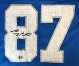 The Sports Integrity Sam LaPorta Signed Detroit Lions Blue Nike Game Replica Jersey features large white numbers 87 with gray outlines and a black autograph across the upper left of the number 8.