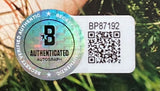 The Sam Smith Signed Framed Love Goes CD Booklet by Sports Integrity features a holographic Beckett autograph sticker (BP87192, QR code) displayed with green grass in the background.