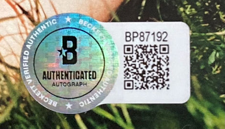 The Sam Smith Signed Framed Love Goes CD Booklet by Sports Integrity features a holographic Beckett autograph sticker (BP87192, QR code) displayed with green grass in the background.