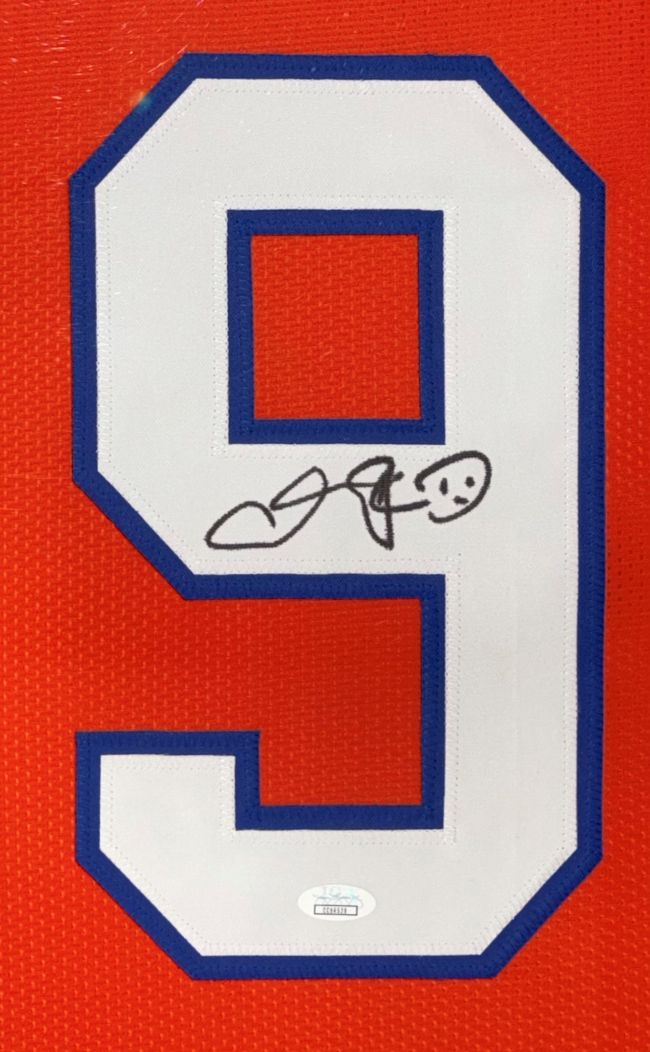 The Sports Integrity Adam Sandler The Waterboy Signed Framed Custom Boucher Football Jersey features the blue-outlined number 9 on red, with Sandler’s black autograph and a smiley face in the white area, authenticated by JSA.