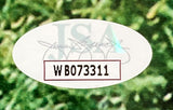 A white oval JSA sticker with black code WB073311 and a script signature appears on The Sandlot Cast Signed Framed 16x20 Photo by Sports Integrity, set against a green leafy background.