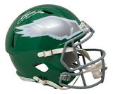 The Sports Integrity Saquon Barkley Signed Eagles FS Kelly Green Replica Speed Helmet (PSA/DNA) features a green helmet with white/silver wing design, gray facemask, white chin strap, and Saquon's signature in white ink.